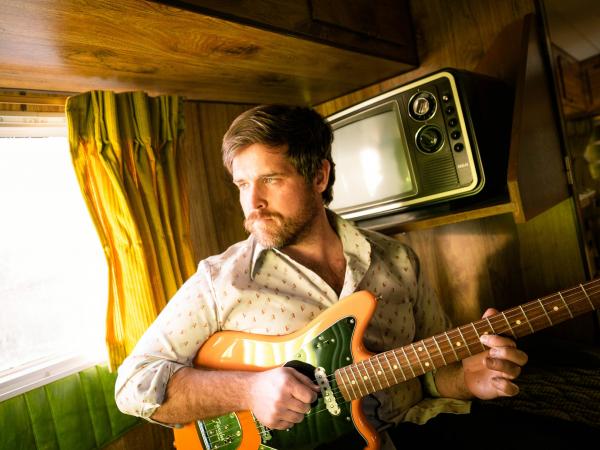 Jessie Blake Rundle Playing Guitar